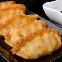 Fried Gyozas (6) · Snack on this succulent dumplings with pork and vegetables.