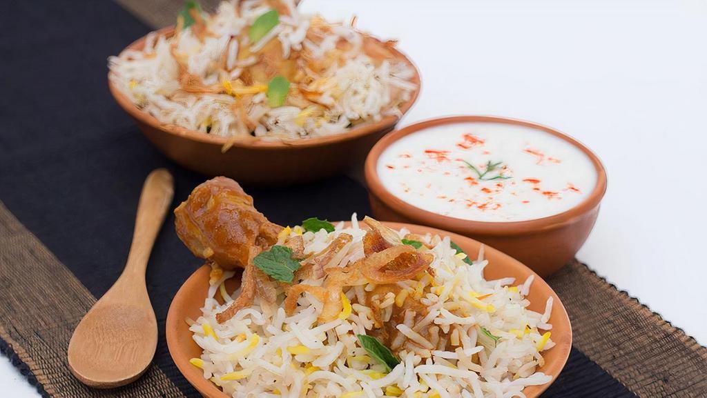 Murgh Noormahal Biryani · Long-grain basmati rice cooked with chicken and aromatic spices