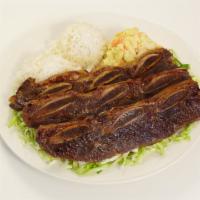 Bbq Short Ribs · Juicy beef short ribs marinated in our house BBQ sauce and grilled to perfection.