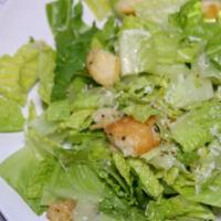 Caesar Salad · Hearts of romaine tossed with parmesan and garlic croutons.
