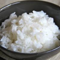 Steamed Rice · A bowl of sticky rice.
