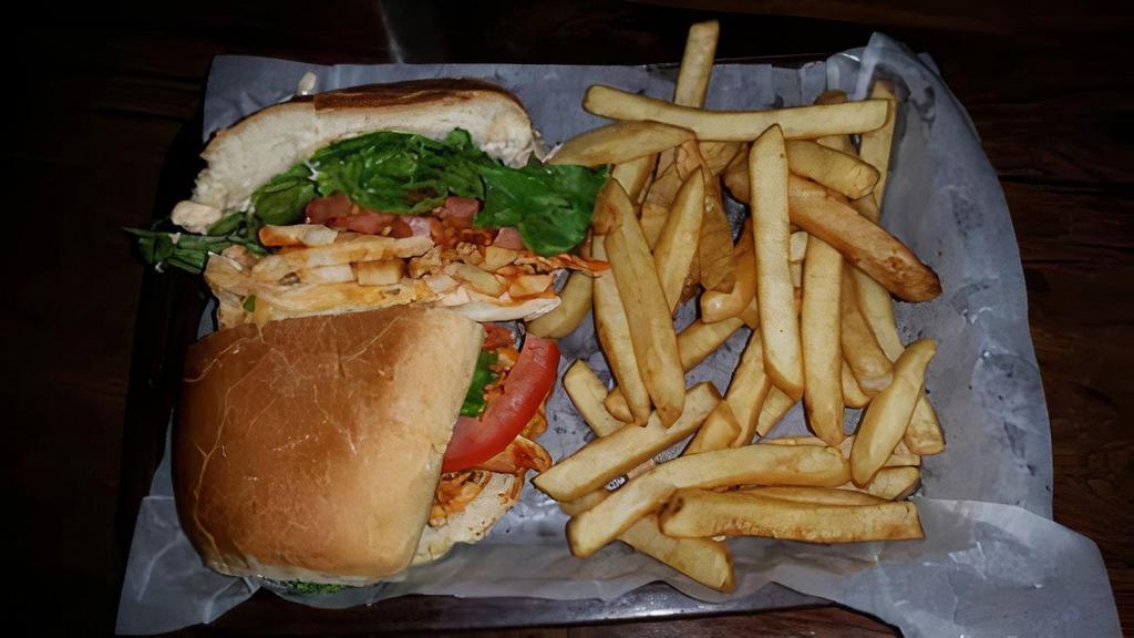 Buffalo Chicken Sandwich · Diced Chicken Breast tossed in Frank’s Red Hot Sauce, Chipotle Mayo, Swiss Cheese, Lettuce, & Tomato on a French Roll. Served with Pickle Spear (On Side) with Fries or Salad.