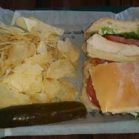 Chicken Delight · Grilled Chicken Breast, Swiss Cheese, Lettuce, Tomato and  Mayo. Served with Pickle Spear (O...