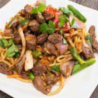 15. Shaking cube Beef over garlic fried rice or chow mein · shaking cube steak stir fried with garlic over rice or chow mein