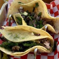 First Street Taco · Your choice of meat, cilantro, and diced onions served on a corn tortilla.