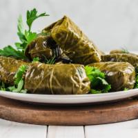 Fg'S Dolma · Ground beef, rice and spices blended together then rolled in grape leaves and steamed.