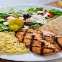 Grilled Salmon Plate · Marinated salmon, cooked on the grill with our special homemade sauce, rice, salad, and humm...