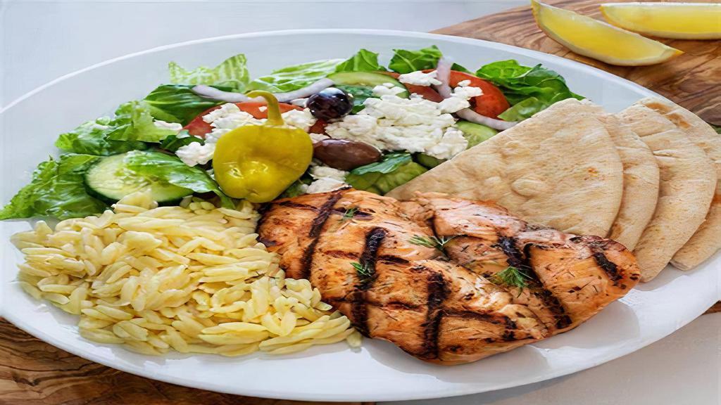Grilled Salmon Combo Platter · Specially marinated Salmon Kebab grilled on open flame. Comes with veggies and sauce