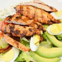 Cobb Salad · Crisp romaine, grilled chicken breast, applewood smoked bacon, avocado, hard boiled eggs, cr...