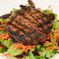 Bunless Burger Salad · Any specialty burger served on top of the house green salad, tossed with balsamic vinaigrett...