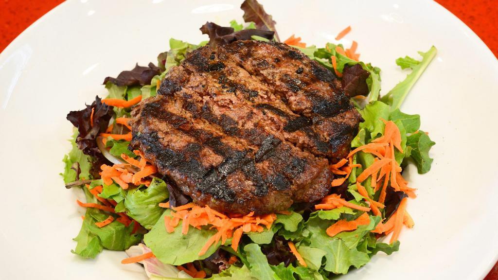 Bunless Burger Salad · Any specialty burger served on top of the house green salad, tossed with balsamic vinaigrette dressing.
