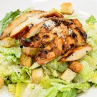 Caesar Salad · Crisp romaine hearts, home-made croutons, parmesan cheese, tossed with a creamy caesar dress...