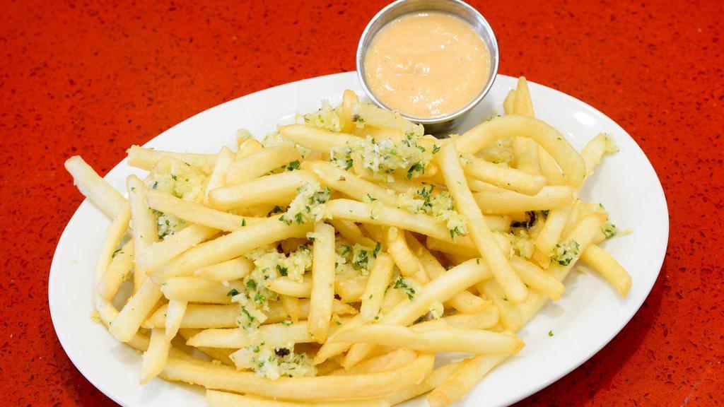 Garlic Fries · Hot and crispy fries covered in delicious garlic.
