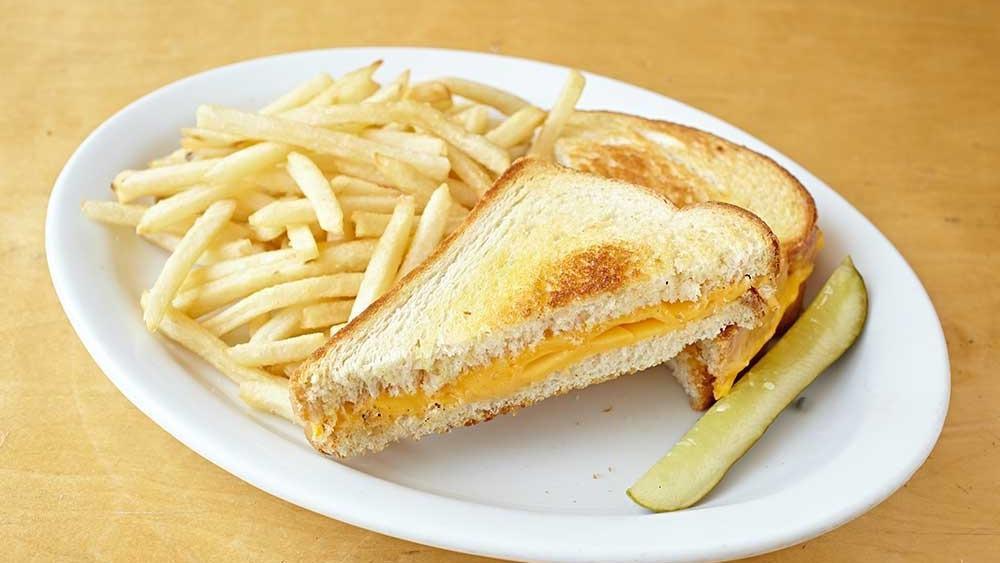 Grilled Cheese · Delicious grilled cheese made with yellow American cheese INCLUDES FRIES