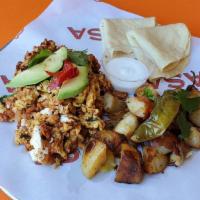 Ancho Chile Shredded Beef C Scramble · Two local Hen Pen eggs scrambled with our ancho chile chilorio beef served with roasted heir...