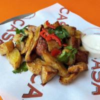 Heirloom Roasted Potatoes · Heirloom fingerling and new potatoes roasted with garlic, onions, serrano chiles and fleur d...