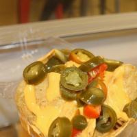 Nachos · Tortilla Chips,  Nacho Cheese, and Jalapeños
This item is a sharable between 2 or more