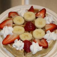 Fresh Fruit Waffle · Homemade waffle with  fresh strawberries, fresh bananas, strawberry  jam and whipped cream