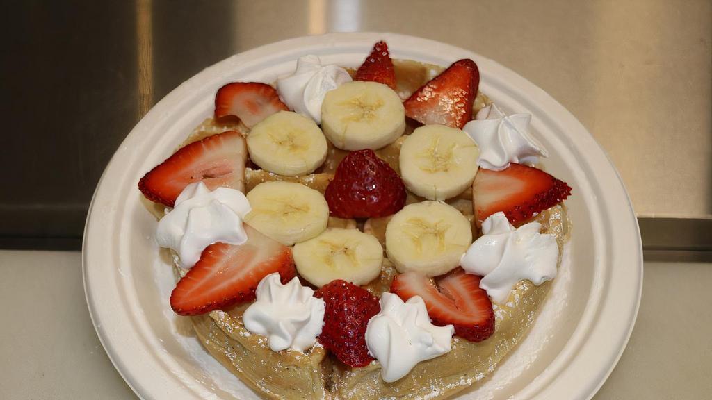 Fresh Fruit Waffle · Homemade waffle with  fresh strawberries, fresh bananas, strawberry  jam and whipped cream