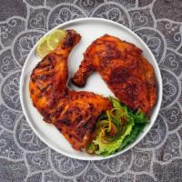 Chicken Leg Tandoori · Juicy chicken leg dipped in a yoghurt & ground spice marinate and baked in a tandoor clay oven
