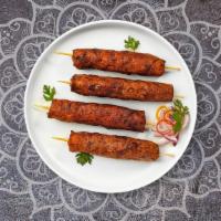 Lamb Seekh Kebab · Boneless chicken breast cooked in clay oven with Indian spices.