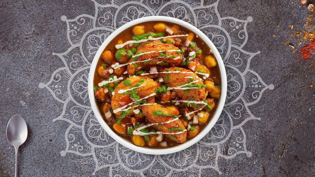 Aloo Tikki Chaat · Potato croquette served on the bed of garbanzo beans.