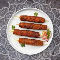 Chicken Seekh Kebab · Two pieces. Ground chicken marinated in spices on skewers and cooked in clay oven.