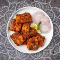Fish Tandoori · Fish marinated in hung curd, carom seeds and spices.