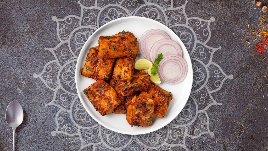 Fish Tandoori · Fish marinated in hung curd, carom seeds and spices.
