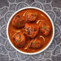 Chicken Tikka Masala · Fresh chicken breasts cooked in a creamy tomato based curry and freshly ground spices