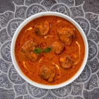 Butter Chicken · Tandoori chicken cooked in a butter based creamy gravy with freshly ground spices.
