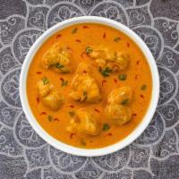 Chicken Korma · Free range chicken cooked in a rich, creamy tomato, and onion curry