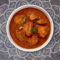 Chicken Curry · Free range chicken breast in a tomato based onion gravy with freshly ground spices.