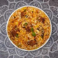 Goat Biryani · Tender goat cubes cooked with Indian spices and basmati rice. Served with house raita.