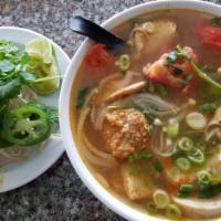 Bun Rieu Soup · Mixed crab meat, tofu, and Vietnamese sausage in tomato chicken broth.