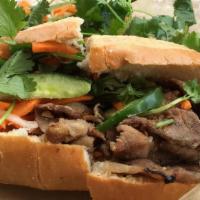 Vegetarian Banh Mi · Vietnamese sandwich with mayonnaise, cucumber, pickled carrots, cilantro, and jalapeno on si...