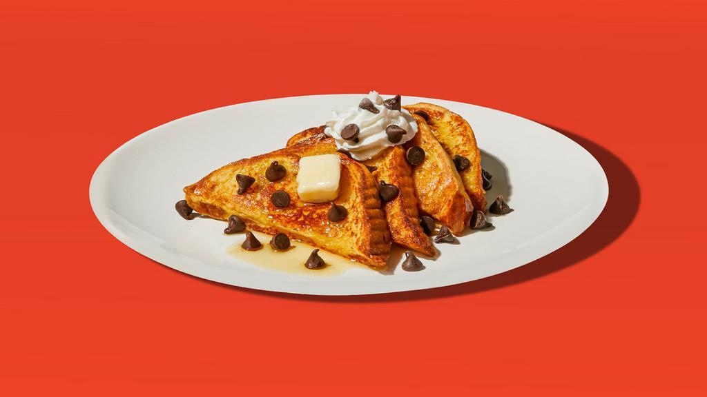 Chocolate Chip French Toast · Two slices of egg-washed french toast topped with whipped cream, chocolate chips, syrup and butter.