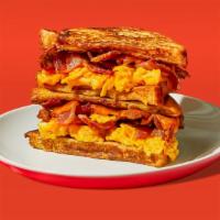 Bacon Egg & Cheese French Toast Sandwich · Two eggs, melted cheese, and bacon served between two slices of french toast.