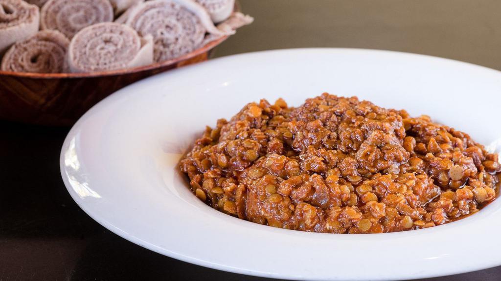 Ye Messer Wot · Vegan. Red lentils cooked slowly with organic ethiopian spices and herbs. Comes with your choice of side.