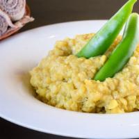 Kik-Alicha · Vegan. Yellow split peas simmered with turmeric, minced onion, garlic, and ginger. Comes wit...