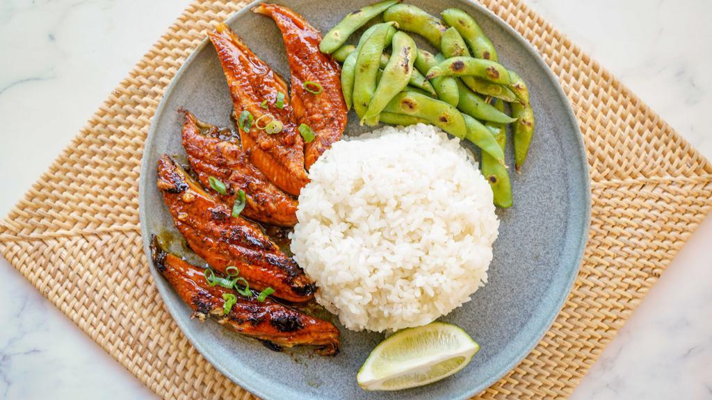 Unagi Plate · Over a bed of rice and includes mixed greens.