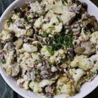 Cauliflower Carbonara · 825 cal. Roasted cauliflower slices in cream sauce with smoky bacon, chicken, mushrooms, par...