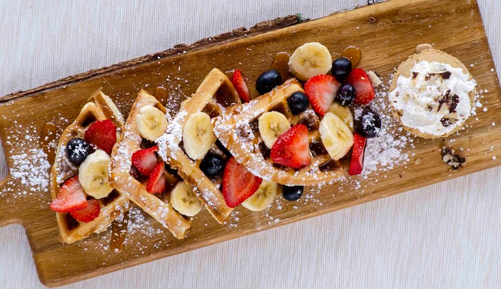 Fruit Waffle · Belgian Waffle topped with fresh straberries, bananas, blueberries and sugar powder. Include mapple syrup