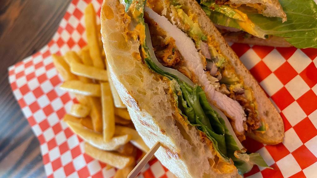 Fried Chicken Sandwich · fried and seasoned chicken, tomato, lettuce, red onion, pickles,  chipotlemayo, mustard and avocado. Include french fries or salad side.