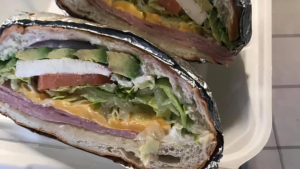 Ham and Cheese sanwich · Cheese, Ham,Tomato, lettuce, red onion, pickles, mayo, mustard . Included french fries or salad side