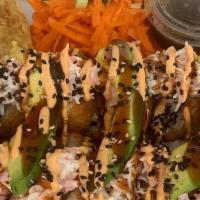 Spill the Tea Roll · 12 pieces
Breaded Inside: Shrimp, Crab, Cream Cheese, cucumber. Drizzled with Surimi, avocad...