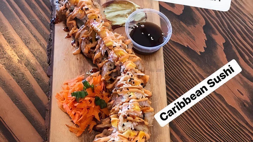 Caribbean Roll · 12 pieces
Breaded with coconut
Inside: Shrimp, Cream Cheese, avocado, cucumber. Dressed with mango, Surimi Salad, Mango and chipotle  Sauce and unagi sauce. on  the side carrots and fried chile