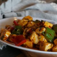 Kung Pao Paneer · Gluten free. Spicy.  Cubed paneer, bell pepper, water chestnut, peanuts, dry red chili. Dry ...