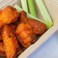 Wings · 6 wings tossed in choice of buffalo, bbq, or sweet chili habanero sauce, served with either ...