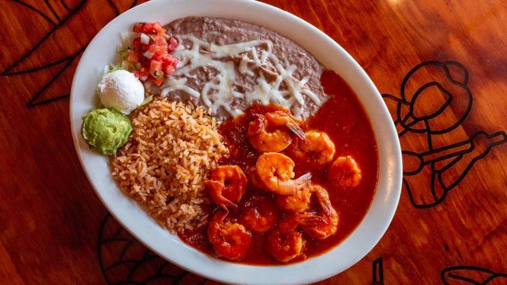 Camarones a la Diabla · Very spicy. Shrimp sauteed in a red chile sauce with a tang of orange. Served with rice, beans, guacamole, sour cream and corn or flour tortillas.